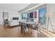 Dining area with city view features a dining table with seating, and hardwood floors at 2700 Las Vegas Blvd # 1202, Las Vegas, NV 89109