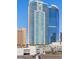 Contemporary high-rise featuring sleek architecture, balconies and city views under a bright blue, cloudless sky at 2700 Las Vegas Blvd # 1202, Las Vegas, NV 89109