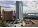 High-rise condo with pool deck, landscaping, and a backdrop of the Las Vegas skyline at 2700 Las Vegas Blvd # 1202, Las Vegas, NV 89109