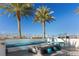 Outdoor rooftop seating area with fire pit, couches, and city views at 2700 Las Vegas Blvd # 1202, Las Vegas, NV 89109