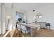 Living and dining area features wood floors, a dining table and desk area with city views at 2700 Las Vegas Blvd # 1202, Las Vegas, NV 89109