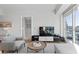 Bright living room boasts comfortable seating, modern entertainment center, and large windows at 2700 Las Vegas Blvd # 1202, Las Vegas, NV 89109