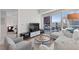 Bright living room with white sofas, city view, and modern decor at 2700 Las Vegas Blvd # 1202, Las Vegas, NV 89109