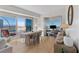 Bright living and dining area offers an open floor plan and floor-to-ceiling windows with city views at 2700 Las Vegas Blvd # 1202, Las Vegas, NV 89109
