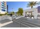 Outdoor lounge area features a covered seating area with couches and views of landscaping at 2700 Las Vegas Blvd # 1202, Las Vegas, NV 89109