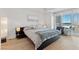 Bright main bedroom features light wood floors, city views, and modern furnishings at 2700 Las Vegas Blvd # 1202, Las Vegas, NV 89109