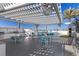 Expansive outdoor dining area with seating, overhead fans, and outdoor kitchen at 2700 Las Vegas Blvd # 1202, Las Vegas, NV 89109
