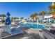 Inviting community pool featuring an umbrella, lounge chairs, and clear blue water at 2700 Las Vegas Blvd # 1202, Las Vegas, NV 89109