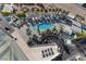Aerial view of a luxury condominium complex featuring pools, palm trees and plenty of lounge chairs at 2700 Las Vegas Blvd # 1202, Las Vegas, NV 89109