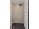 Walk-in shower features neutral stone walls, rainfall shower head, and dark tile flooring at 2700 Las Vegas Blvd # 1202, Las Vegas, NV 89109