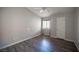 Neutral bedroom featuring hardwood floors, a ceiling fan, and a bright window at 2725 S Nellis Blvd # 2045, Las Vegas, NV 89121