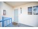 Front door entrance featuring a secure screen door, overhead light and adjacent window for bright, welcoming entry at 2725 S Nellis Blvd # 2045, Las Vegas, NV 89121
