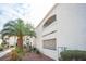 A garden-style condominium complex featuring stucco exterior, desert landscaping, and blue trim at 2725 S Nellis Blvd # 2045, Las Vegas, NV 89121