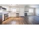 View of the kitchen with stainless steel appliances, white cabinetry and hardwood floors at 2725 S Nellis Blvd # 2045, Las Vegas, NV 89121