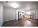 View of the kitchen with stainless steel appliances, white cabinetry and hardwood floors at 2725 S Nellis Blvd # 2045, Las Vegas, NV 89121