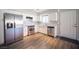 View of the kitchen with stainless steel appliances, white cabinetry and hardwood floors at 2725 S Nellis Blvd # 2045, Las Vegas, NV 89121