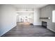 Spacious living room with a fireplace, hardwood flooring and open view into the kitchen at 2725 S Nellis Blvd # 2045, Las Vegas, NV 89121