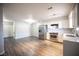 Open-concept living room and kitchen area, featuring modern stainless steel appliances and light gray walls at 2725 S Nellis Blvd # 2045, Las Vegas, NV 89121