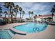 Community pool featuring sun loungers, seating areas, and a clear blue swimming pool under a partly cloudy sky at 2725 S Nellis Blvd # 2045, Las Vegas, NV 89121