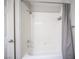 Clean shower with white subway tile and neutral curtain at 2725 S Nellis Blvd # 2045, Las Vegas, NV 89121