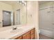 Bright bathroom featuring a single sink vanity and shower over tub at 28 Birkdale Dr, Henderson, NV 89074