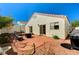 Charming backyard featuring a brick patio, dining area, and lush landscaping at 280 Pear Meadow St, Henderson, NV 89012