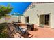 Serene backyard with a brick patio, outdoor seating, and a well-maintained garden at 280 Pear Meadow St, Henderson, NV 89012