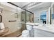 Updated bathroom featuring a walk-in shower with glass doors, grab bars, and modern fixtures at 280 Pear Meadow St, Henderson, NV 89012