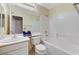Bathroom features a sink, toilet, and tub with white tiling and a shower head at 280 Pear Meadow St, Henderson, NV 89012