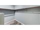 Walk-in closet with wood-look flooring and ample hanging space at 280 Pear Meadow St, Henderson, NV 89012