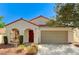 Charming single-story home with desert landscaping, tile roof, and covered porch at 280 Pear Meadow St, Henderson, NV 89012