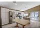 Bright, open kitchen featuring white cabinets, stainless steel appliances, and an eat-in island at 280 Pear Meadow St, Henderson, NV 89012