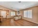 Bright living room features a vaulted ceiling, wood tile floors, and ample natural light at 280 Pear Meadow St, Henderson, NV 89012