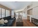 Open floor plan featuring a fireplace, comfortable seating, and views to the kitchen area at 280 Pear Meadow St, Henderson, NV 89012