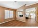 Open-concept living area with wood tile flooring and views to the dining and kitchen areas at 280 Pear Meadow St, Henderson, NV 89012