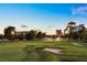 Picturesque golf course with sprinklers watering the green grass, a sand trap and city skyline in the distance at 2838 Geary Pl # 4002, Las Vegas, NV 89109