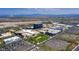 Expansive aerial view shows commercial buildings, parking, and community layout against a backdrop of distant mountains at 320 Lorelei Rock St, Las Vegas, NV 89138