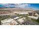 Aerial view of commercial buildings with parking and mountains in the distance, showcasing its location and accessibility at 320 Lorelei Rock St, Las Vegas, NV 89138