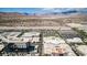 High aerial view captures the entire city, showcasing homes and local stores at 320 Lorelei Rock St, Las Vegas, NV 89138