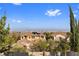 Beautiful city views of the Las Vegas skyline, tile roofs, mature trees, and blue skies at 320 Lorelei Rock St, Las Vegas, NV 89138