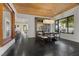 Dining room with a wood ceiling and a large window with a view of the pool area at 320 Lorelei Rock St, Las Vegas, NV 89138