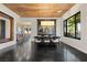 Dining room with a wooden ceiling, a large window overlooking the yard, and dark wood floors at 320 Lorelei Rock St, Las Vegas, NV 89138