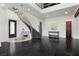 Elegant foyer with a curved staircase, chandelier, and stylish decor at 320 Lorelei Rock St, Las Vegas, NV 89138