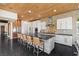 Modern kitchen features a long island with bar seating and stainless steel appliances at 320 Lorelei Rock St, Las Vegas, NV 89138