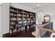 Hallway featuring a large custom built-in bookcase at 320 Lorelei Rock St, Las Vegas, NV 89138