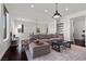 Bright living room featuring large sofa, area rug and modern décor at 320 Lorelei Rock St, Las Vegas, NV 89138