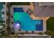 Aerial perspective of the pool area, featuring a spa, lounge chairs, and meticulously designed tile work at 320 Lorelei Rock St, Las Vegas, NV 89138