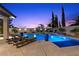 Relaxing pool area with lounge chairs and manicured landscaping at 320 Lorelei Rock St, Las Vegas, NV 89138