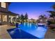 Backyard pool and spa with inset tile and accent lighting at 320 Lorelei Rock St, Las Vegas, NV 89138