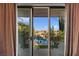 Balcony view of the backyard pool, lush landscaping, and neighborhood at 320 Lorelei Rock St, Las Vegas, NV 89138
